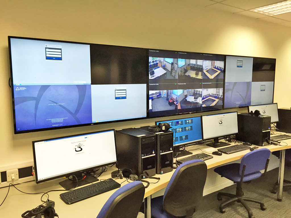 Hydra control room with a row of workstations and wall-mounted screens