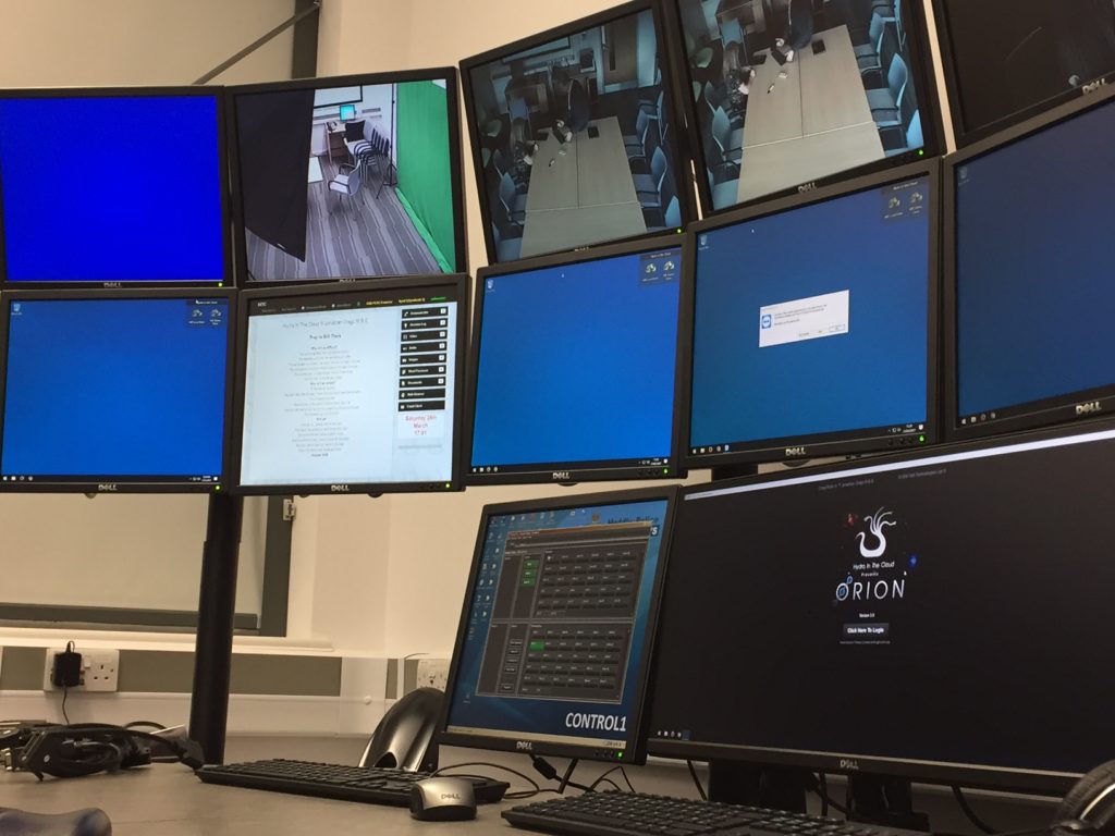 Hydra control workstation beneath a bank of video and computer displays