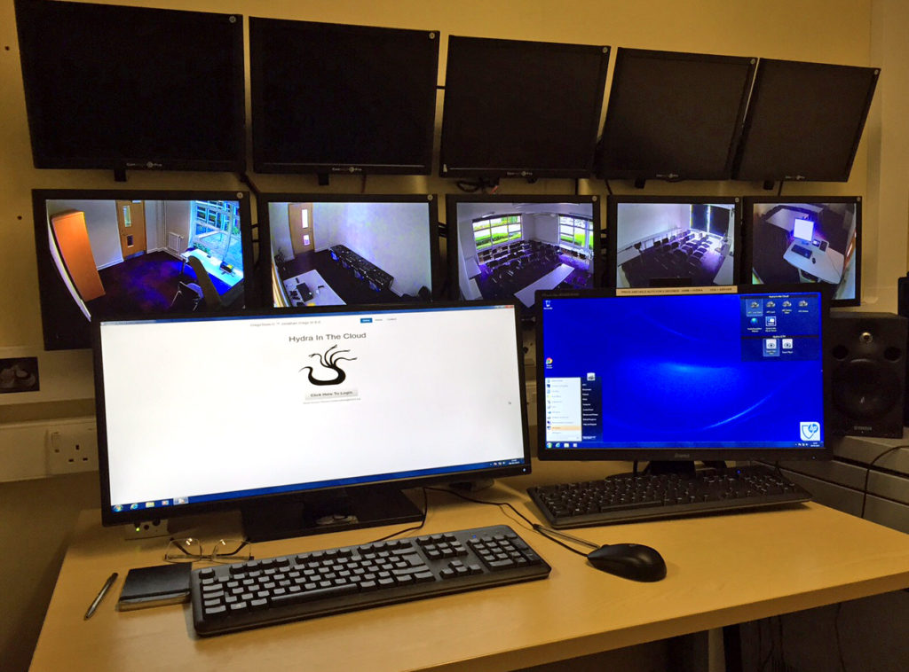 Hydra workstation with multiple screens showing syndicate rooms